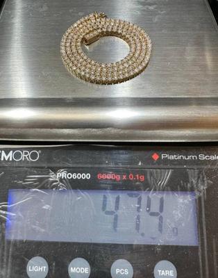 14 k Gold diamond tennis chain 22 in