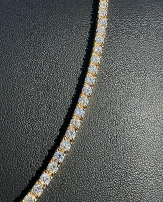 14 k Gold diamond tennis chain 22 in