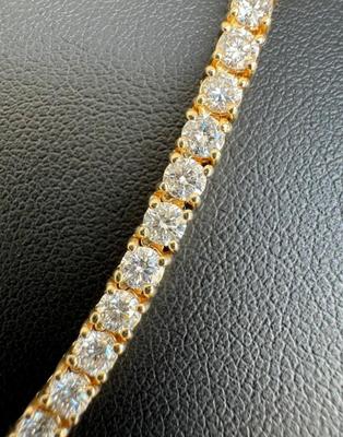 14 k Gold diamond tennis chain 22 in