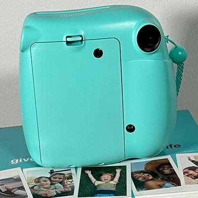 LOT 84L: Fujifilm Instax Mini 7+ Instant Camera w/ Original Box and Accessories