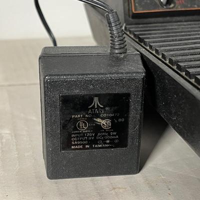 LOT 85L: Vintage Atari 2600 Console, Controller, Paddles and Games in Case