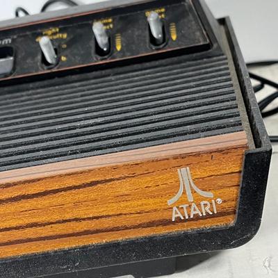 LOT 85L: Vintage Atari 2600 Console, Controller, Paddles and Games in Case