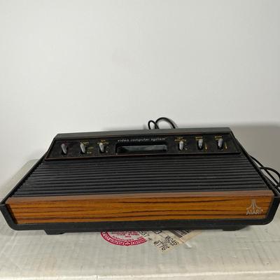 LOT 85L: Vintage Atari 2600 Console, Controller, Paddles and Games in Case
