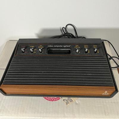 LOT 85L: Vintage Atari 2600 Console, Controller, Paddles and Games in Case