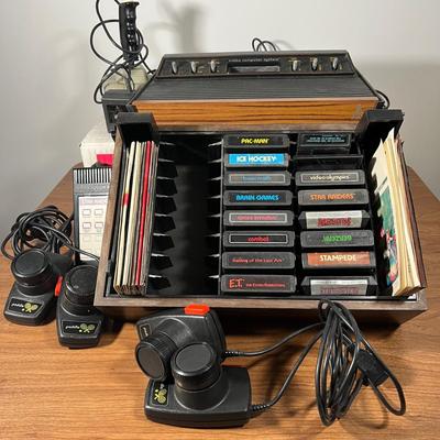LOT 85L: Vintage Atari 2600 Console, Controller, Paddles and Games in Case