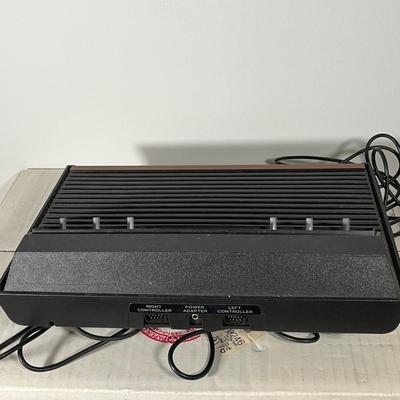 LOT 85L: Vintage Atari 2600 Console, Controller, Paddles and Games in Case