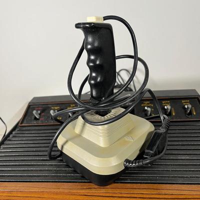 LOT 85L: Vintage Atari 2600 Console, Controller, Paddles and Games in Case