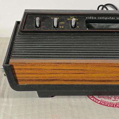 LOT 85L: Vintage Atari 2600 Console, Controller, Paddles and Games in Case