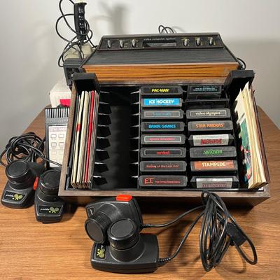 LOT 85L: Vintage Atari 2600 Console, Controller, Paddles and Games in Case