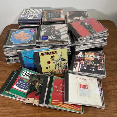 LOT 92L: Big Collection of CDs - Nirvana, The Cars, Madonna, Billy Joel, Janet Jackson, Christmas, and More