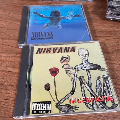 LOT 92L: Big Collection of CDs - Nirvana, The Cars, Madonna, Billy Joel, Janet Jackson, Christmas, and More