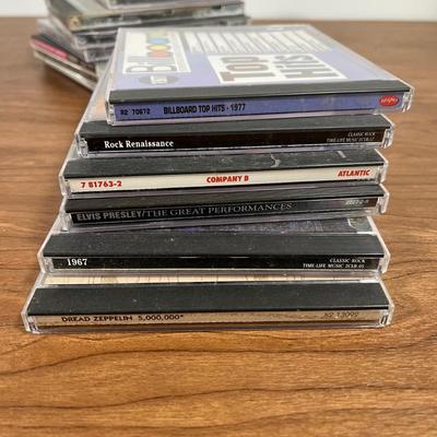 LOT 92L: Big Collection of CDs - Nirvana, The Cars, Madonna, Billy Joel, Janet Jackson, Christmas, and More