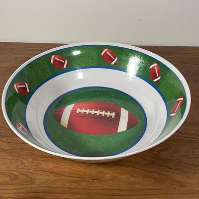 LOT 100L: Football Themed Home Decor, Party Essentials, Serving Pieces, Football-Shaped Crockpot and More