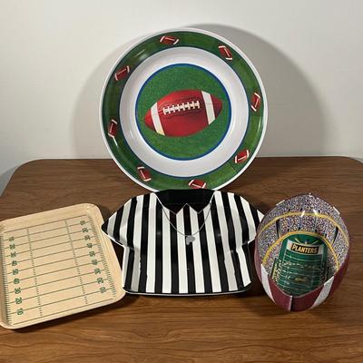 LOT 100L: Football Themed Home Decor, Party Essentials, Serving Pieces, Football-Shaped Crockpot and More