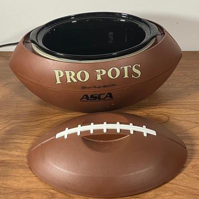 LOT 100L: Football Themed Home Decor, Party Essentials, Serving Pieces, Football-Shaped Crockpot and More