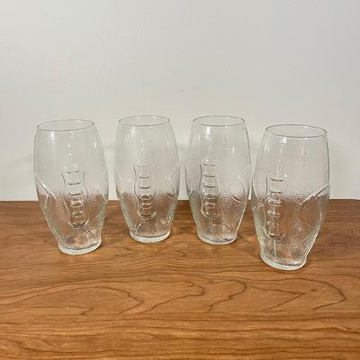 LOT 100L: Football Themed Home Decor, Party Essentials, Serving Pieces, Football-Shaped Crockpot and More