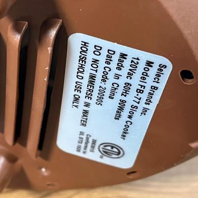 LOT 100L: Football Themed Home Decor, Party Essentials, Serving Pieces, Football-Shaped Crockpot and More