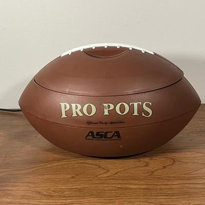 LOT 100L: Football Themed Home Decor, Party Essentials, Serving Pieces, Football-Shaped Crockpot and More