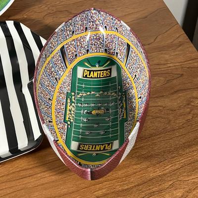 LOT 100L: Football Themed Home Decor, Party Essentials, Serving Pieces, Football-Shaped Crockpot and More