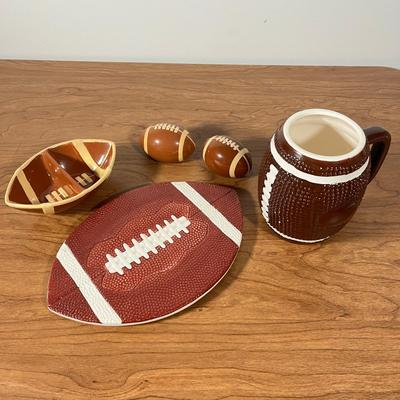 LOT 100L: Football Themed Home Decor, Party Essentials, Serving Pieces, Football-Shaped Crockpot and More