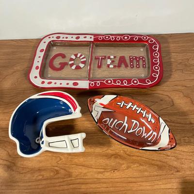 LOT 100L: Football Themed Home Decor, Party Essentials, Serving Pieces, Football-Shaped Crockpot and More