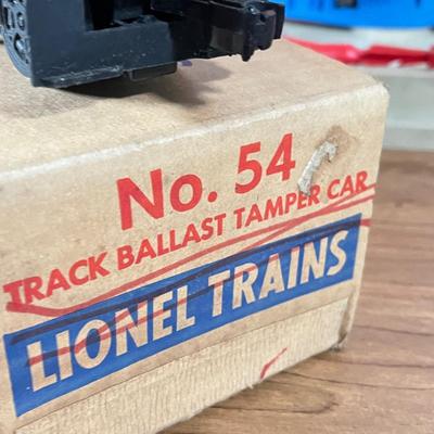 LOT 117L: Collection of Vintage Lionel Trains - Missile Launching Platform and Train Car, Exploding Ammunition Dump and More