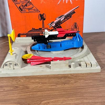 LOT 117L: Collection of Vintage Lionel Trains - Missile Launching Platform and Train Car, Exploding Ammunition Dump and More