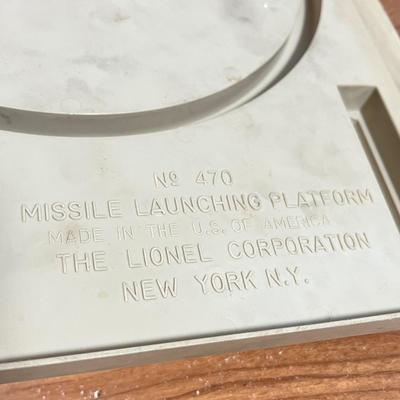 LOT 117L: Collection of Vintage Lionel Trains - Missile Launching Platform and Train Car, Exploding Ammunition Dump and More