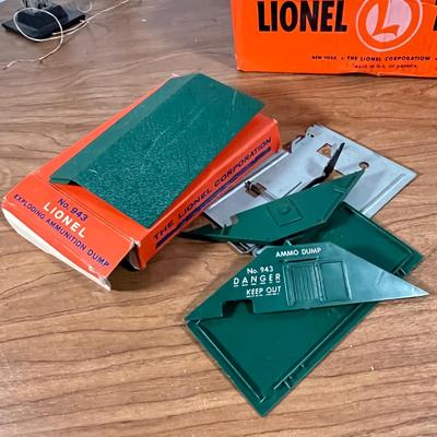 LOT 117L: Collection of Vintage Lionel Trains - Missile Launching Platform and Train Car, Exploding Ammunition Dump and More
