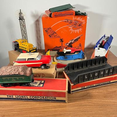 LOT 117L: Collection of Vintage Lionel Trains - Missile Launching Platform and Train Car, Exploding Ammunition Dump and More
