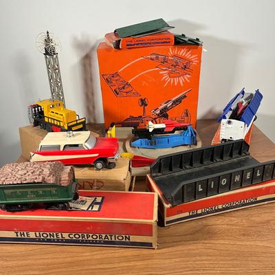 LOT 117L: Collection of Vintage Lionel Trains - Missile Launching Platform and Train Car, Exploding Ammunition Dump and More