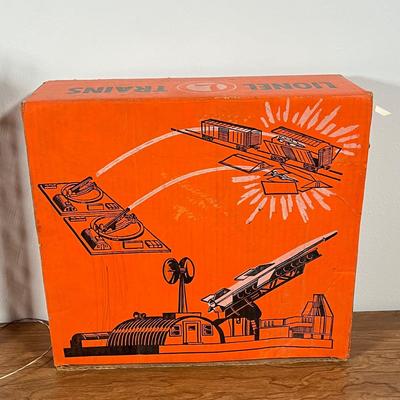 LOT 117L: Collection of Vintage Lionel Trains - Missile Launching Platform and Train Car, Exploding Ammunition Dump and More