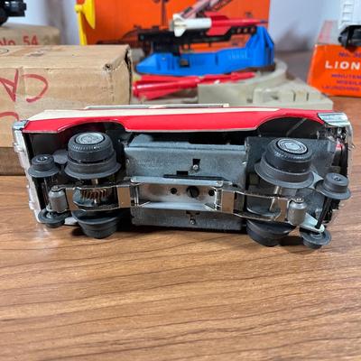 LOT 117L: Collection of Vintage Lionel Trains - Missile Launching Platform and Train Car, Exploding Ammunition Dump and More