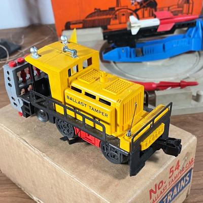 LOT 117L: Collection of Vintage Lionel Trains - Missile Launching Platform and Train Car, Exploding Ammunition Dump and More