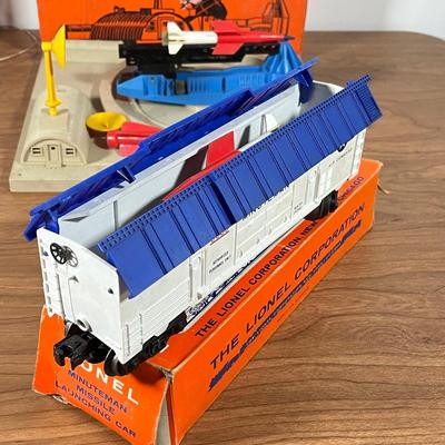 LOT 117L: Collection of Vintage Lionel Trains - Missile Launching Platform and Train Car, Exploding Ammunition Dump and More