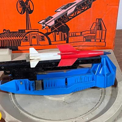 LOT 117L: Collection of Vintage Lionel Trains - Missile Launching Platform and Train Car, Exploding Ammunition Dump and More