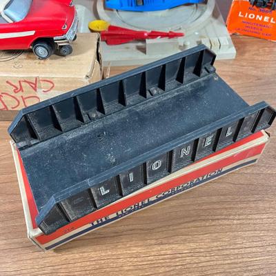 LOT 117L: Collection of Vintage Lionel Trains - Missile Launching Platform and Train Car, Exploding Ammunition Dump and More