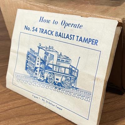 LOT 117L: Collection of Vintage Lionel Trains - Missile Launching Platform and Train Car, Exploding Ammunition Dump and More