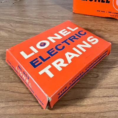 LOT 117L: Collection of Vintage Lionel Trains - Missile Launching Platform and Train Car, Exploding Ammunition Dump and More