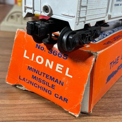 LOT 117L: Collection of Vintage Lionel Trains - Missile Launching Platform and Train Car, Exploding Ammunition Dump and More