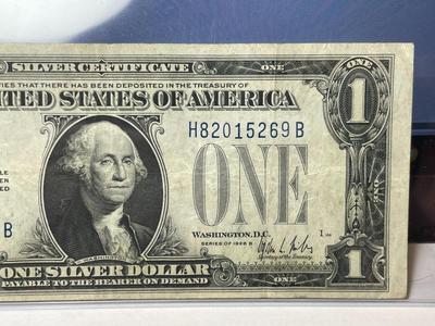 SERIES OF 1928-B FINE/VERY FINE CONDITION "FUNNY BACK" SILVER CERTIFICATE AS PICTURED.