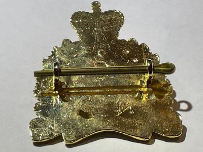 Scarce RCMP Royal Canadian Mounted Police Cap Badge -Gilt & Enameled in VG Preowned Condition.