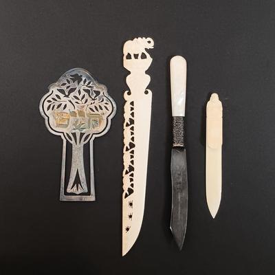 LOT 436: A Little Museum Collection- Folding Metal Book End, Stylized Letter Openers, Woven Shawl, Beaded Hummingbird & More