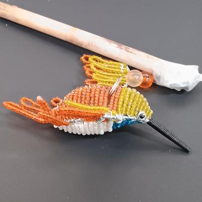 LOT 436: A Little Museum Collection- Folding Metal Book End, Stylized Letter Openers, Woven Shawl, Beaded Hummingbird & More