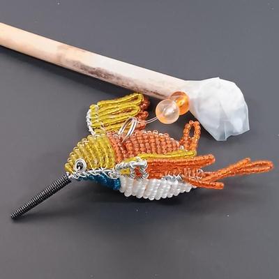 LOT 436: A Little Museum Collection- Folding Metal Book End, Stylized Letter Openers, Woven Shawl, Beaded Hummingbird & More