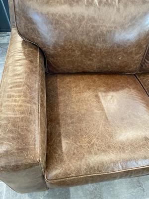 Beautiful leather sectional & ottoman from Northern Home