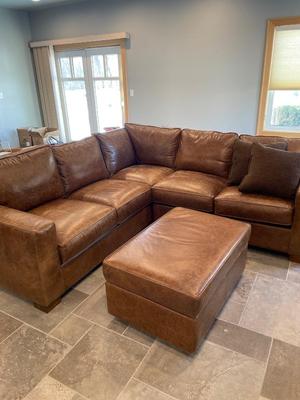 Beautiful leather sectional & ottoman from Northern Home