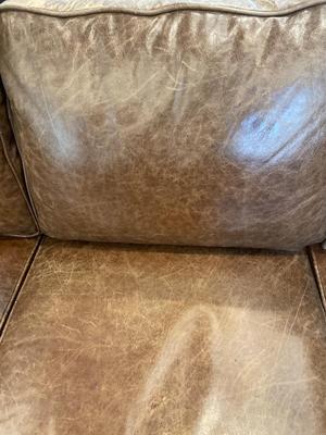 Beautiful leather sectional & ottoman from Northern Home