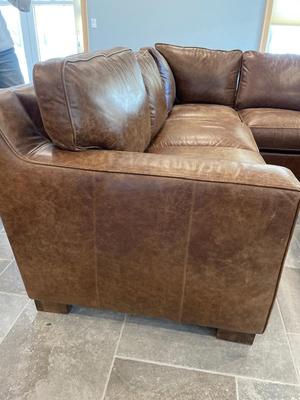 Beautiful leather sectional & ottoman from Northern Home
