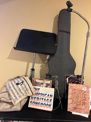 LOT 105B: Big Music Lot - Guitar Case, Sheet Music Stand and Books, Instrument and Mic Stands and More